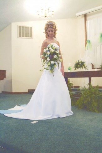 This gorgeous cascading bridal bouquet features ivory flowers with a hint of