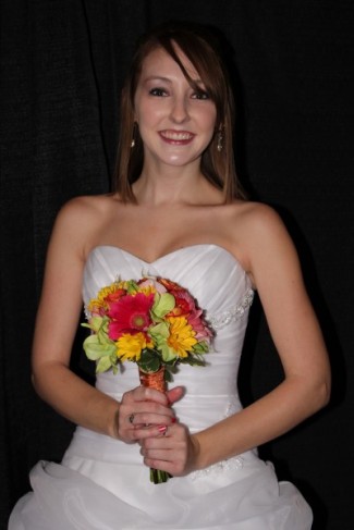 It adds a nice pop of color against her strapless wedding gown