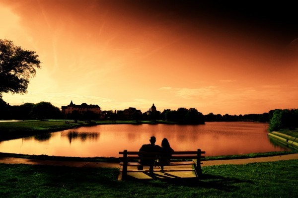 Sunset Romantic Photo Share This couple sit and watch the sun dance across