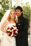 Bride & Groom with red-wood and ivory rose wedding bouquet