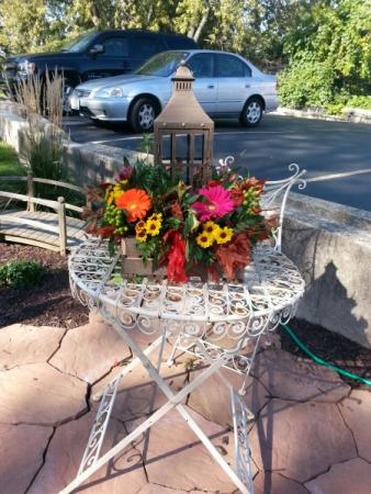 Lantern Centerpiece Surrounded by Beautiful Flowers