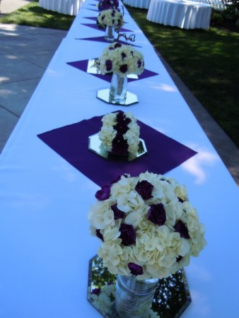 Brides Table Using The Bouquets of the Girls For the Centerpieces