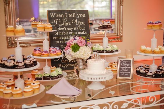 The couple ceremoniously cut a small cake and served assorted cupcakes for dessert.